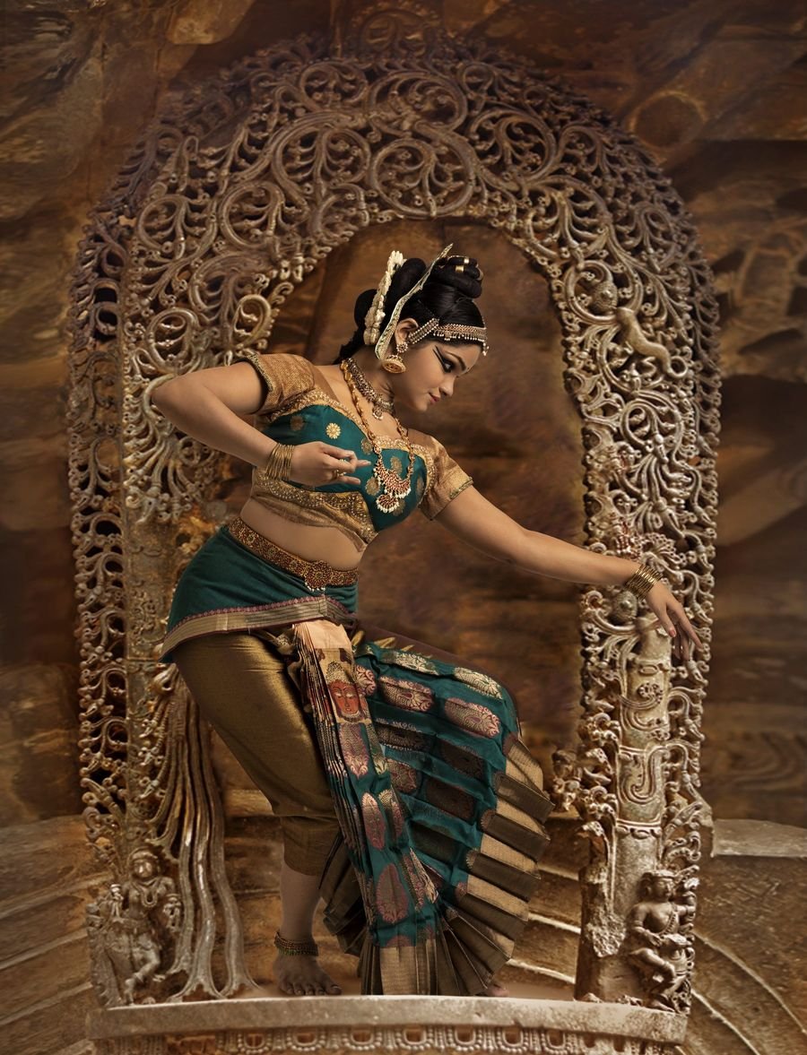 Shobana performing in a carved temple setting
