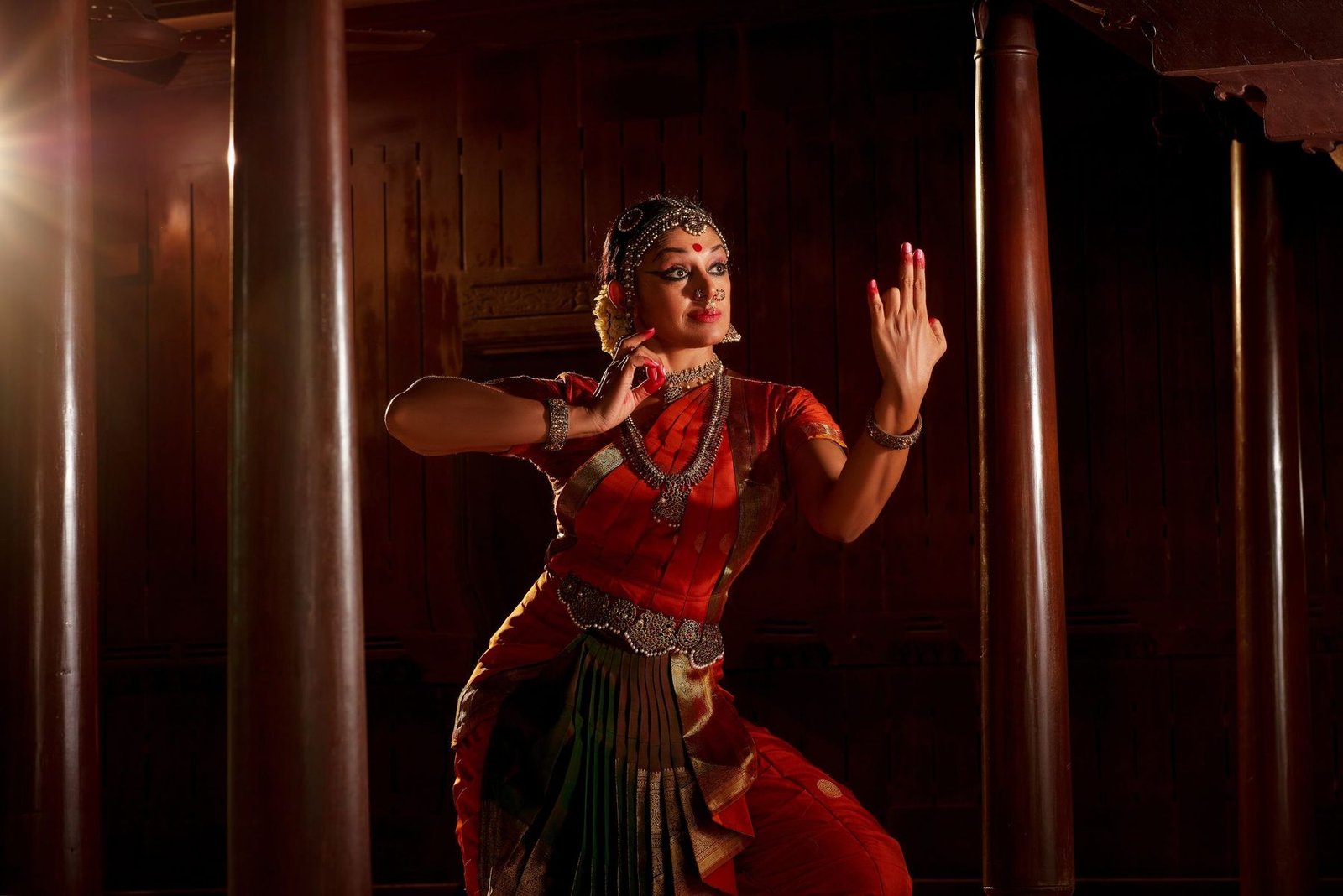 Shobana performing under warm stage light